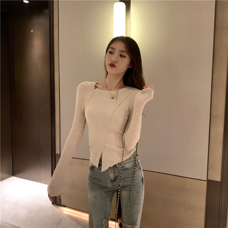 Actual shot of slim-fitting T-shirt top with irregular hem