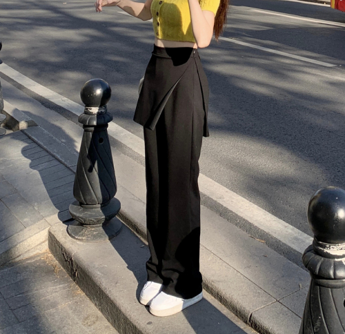 Real shot of ruffled slimming trousers, black slightly flared thin high-waisted trousers