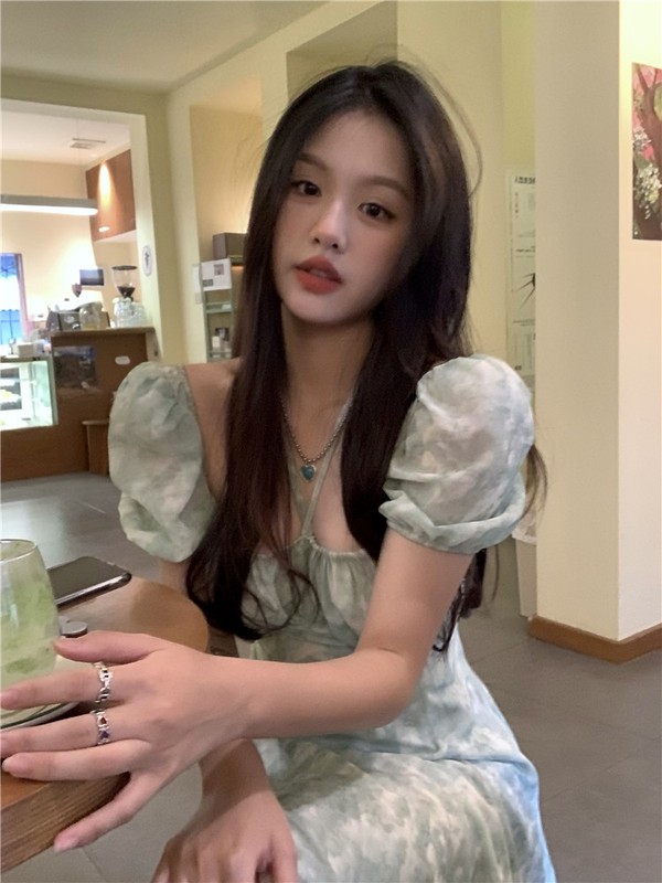Actual shot of one-shoulder floral halterneck suspender dress for women with slit, square neck, puff sleeves, mid-length skirt