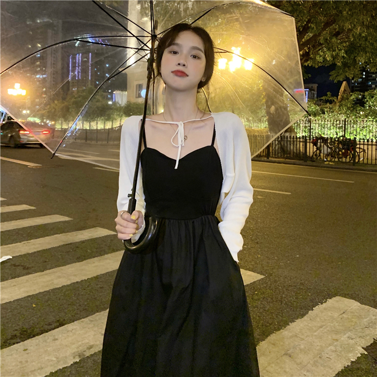 Real shot of waist-cinched, versatile suspender black dress + short, long-sleeved, stylish lace-up cardigan