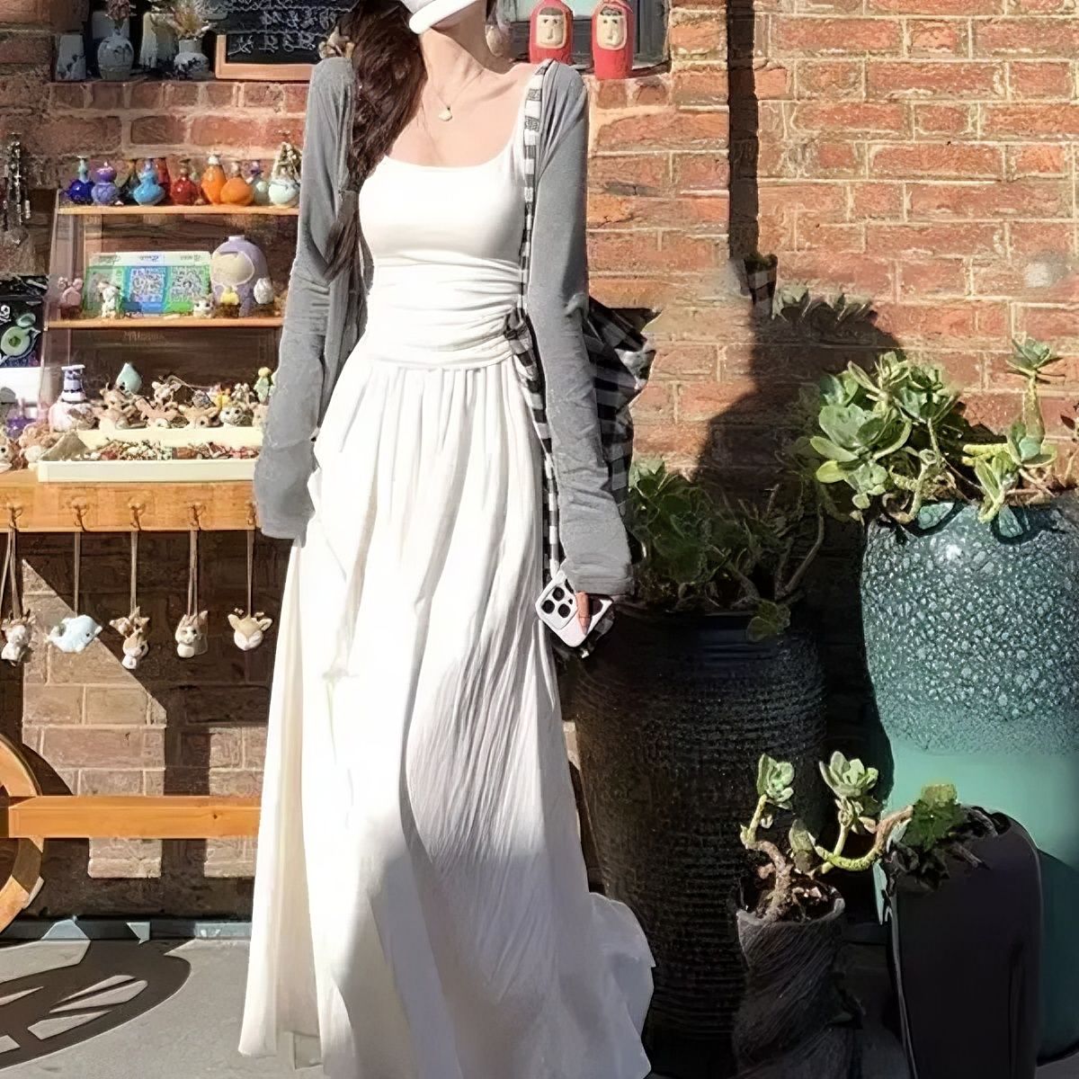 Hepburn-style white temperament three-piece set, lazy style, slimming cardigan, straps, high-waisted skirt, casual suit