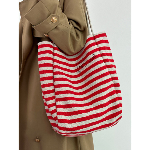 Large-capacity striped canvas bag women's new niche embroidery lazy style commuter portable shoulder tote bag