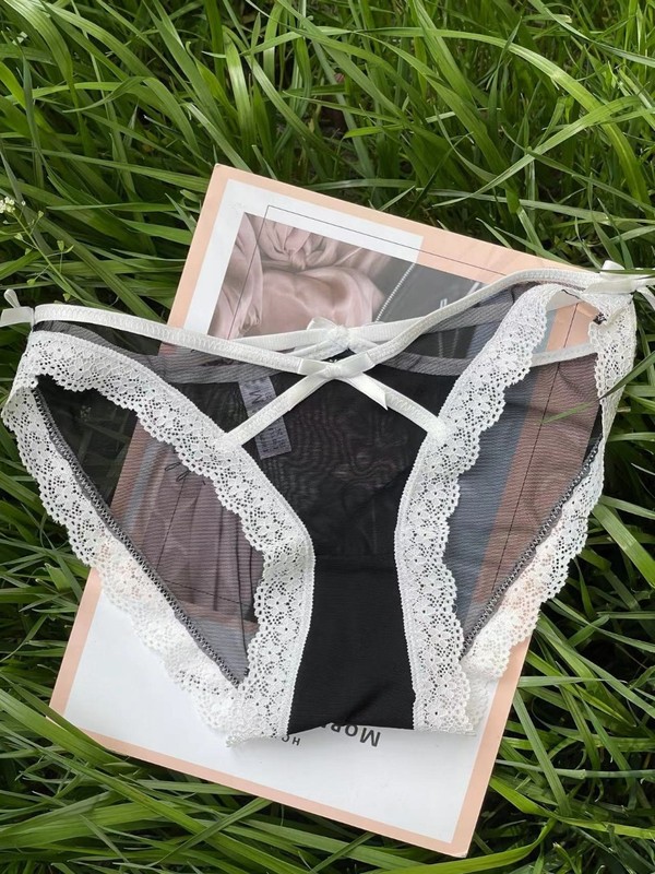 European and American sexy underwear for women, lace edge low-waist see-through mesh briefs cross bow seductive underwear