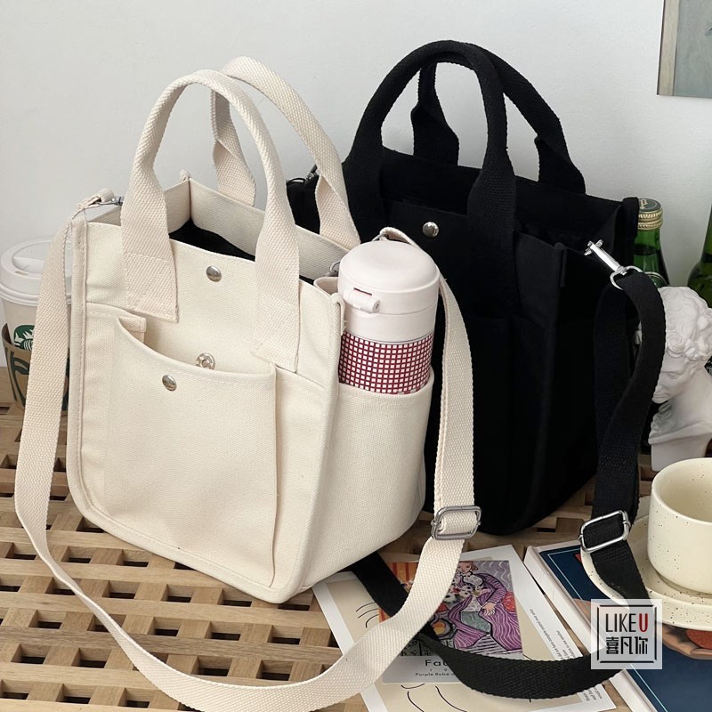 Original design, stylish three-dimensional tote canvas hand-carrying cross-body bag, simple and versatile one-shoulder portable lunch box bag