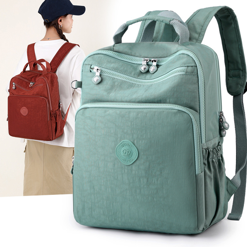 Bobu men's and women's backpacks are lightweight multi-layered student computer schoolbags with large travel capacity and can be inserted into travel luggage pole backpacks