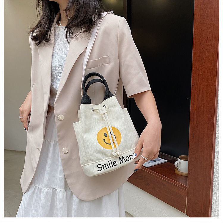 Simple smiley face printed bucket bag for women 2024 new Japanese and Korean students cute canvas shoulder bag handbag