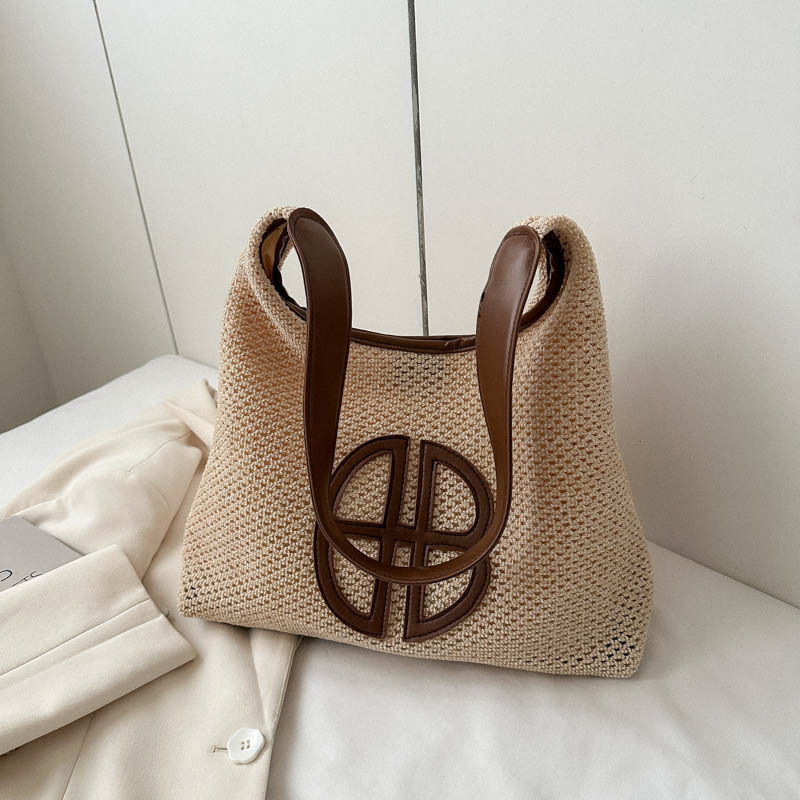 Niche hollow design bag for women 2024 new fashion straw shoulder bag versatile armpit woven tote bag
