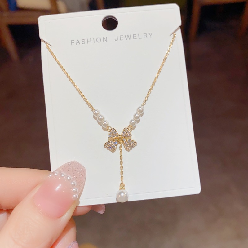 Sweet niche light luxury jewelry women's new bow pearl necklace pendant clavicle chain sweater chain