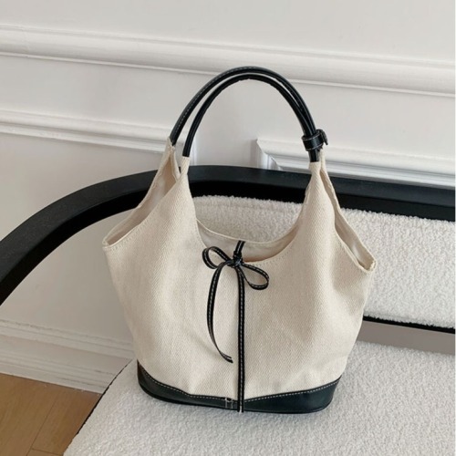 Korean niche stitched canvas tote bag for women 2024 new commuter fashion handbag versatile single shoulder armpit bag