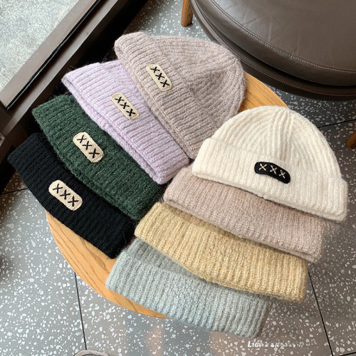 Loose fit small knitted hat that shows your face. The shop owner recommends slimming ear protection pullover cap melon skin hat for men and woolen hat for women.