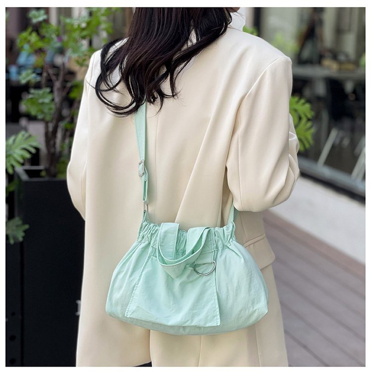 Korean version ins new fashion nylon canvas pleated handbag niche lightweight solid color one-shoulder cross-body bucket bag