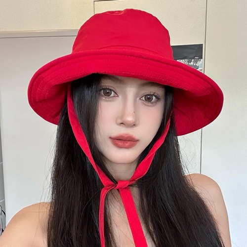 Red versatile Korean style strappy fisherman hat for women, lightweight, breathable, large brim, travel-showing face, small sunshade hat