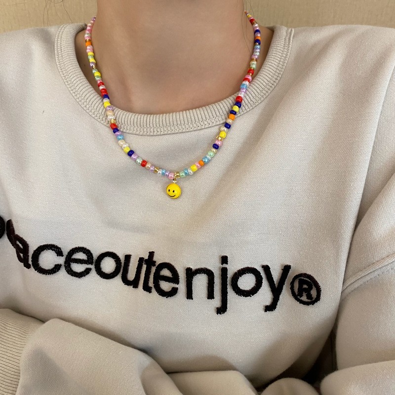 New year's new color beaded smiley sweatshirt necklace women's high-end design niche hot girl clavicle chain accessories