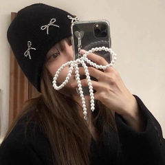 Ins blogger's same style pearl bow pendant 14 is suitable for iphone15pro max apple 13 mobile phone case 16