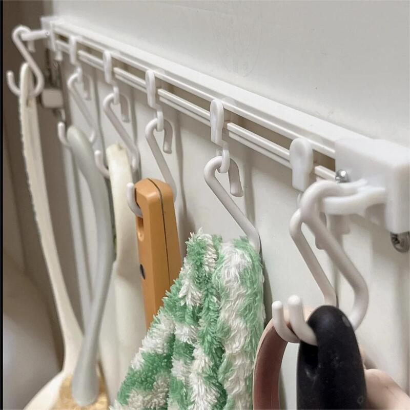 Sliding hook kitchen storage artifact behind the door s-stick hooks row hooks without punching a row of hangers with a row of s-shaped tracks