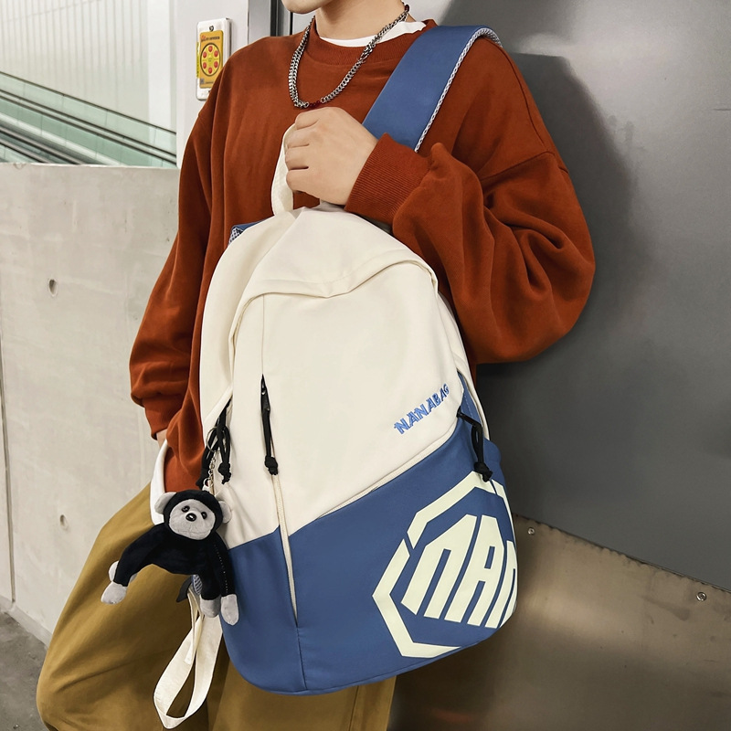 Casual large capacity niche design backpack college student backpack men's new contrast color junior high school student school bag wholesale