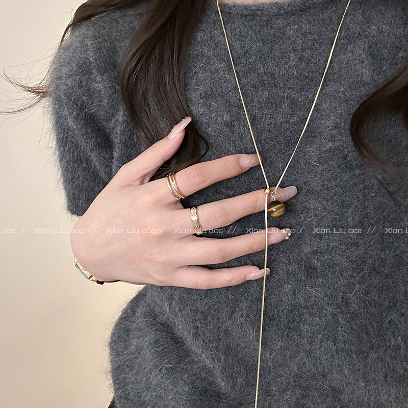New autumn and winter Maillard tiger eye stone gold snake bone long pull-out sweater chain versatile retro high-end necklace
