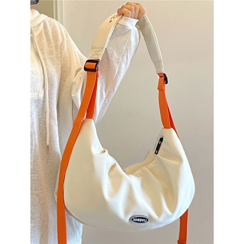 Japanese large-capacity canvas bag, new style, fashionable nylon waterproof one-shoulder diagonal dumpling bag for college students and men in class