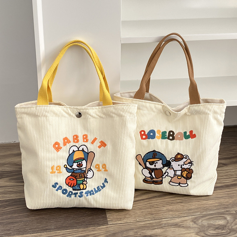 Ye language/cartoon embroidery hand bag women's spring new large-capacity corduroy lunch bag