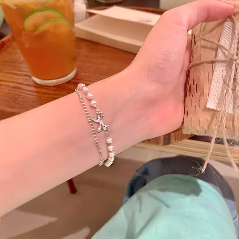 Double-layer bow pearl stacked bracelet light luxury niche exquisite bracelet summer female high-end student hand jewelry