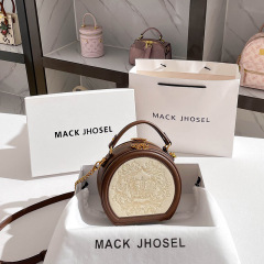 High-end retro small round bag 2024 light luxury portable cross-body round cake bag wholesale