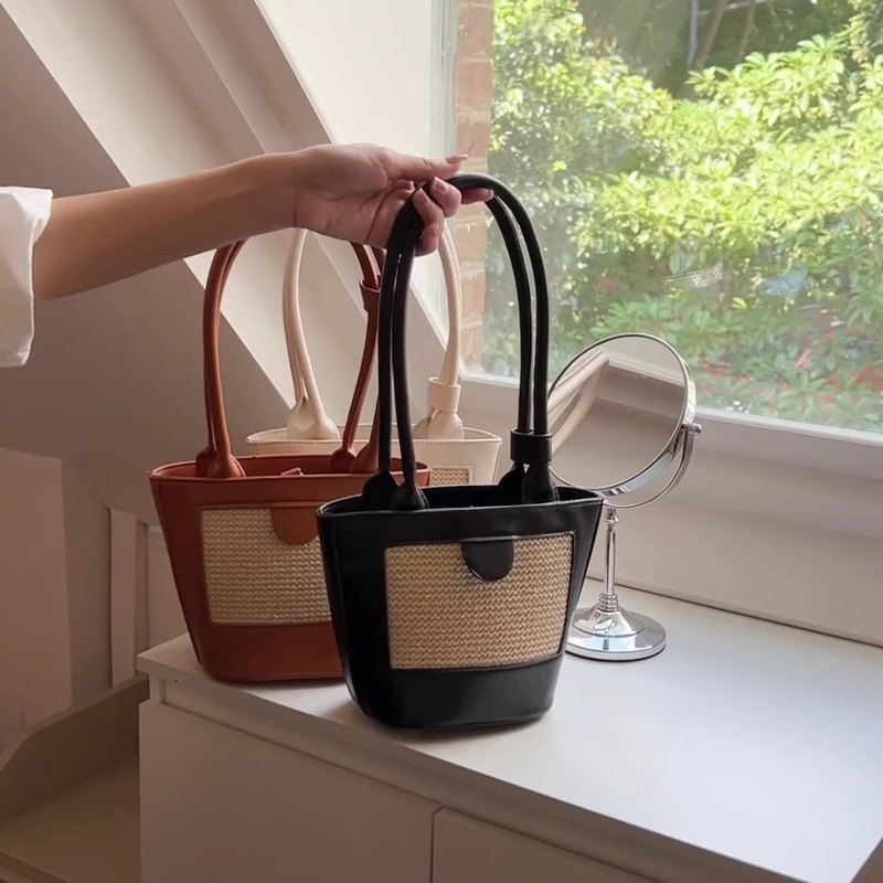 Korean niche design straw hand-held small bag spring new bucket bag retro hand-carried one-shoulder armpit bag