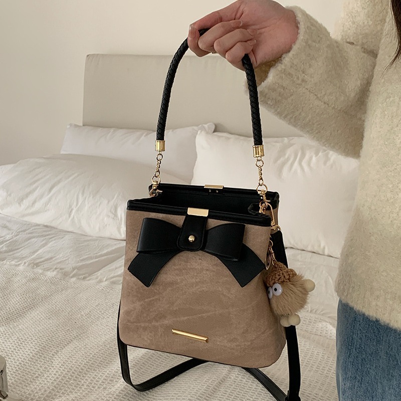 Niche design high-end bow retro literary hand-held bucket bag women's casual versatile shoulder crossbody bag