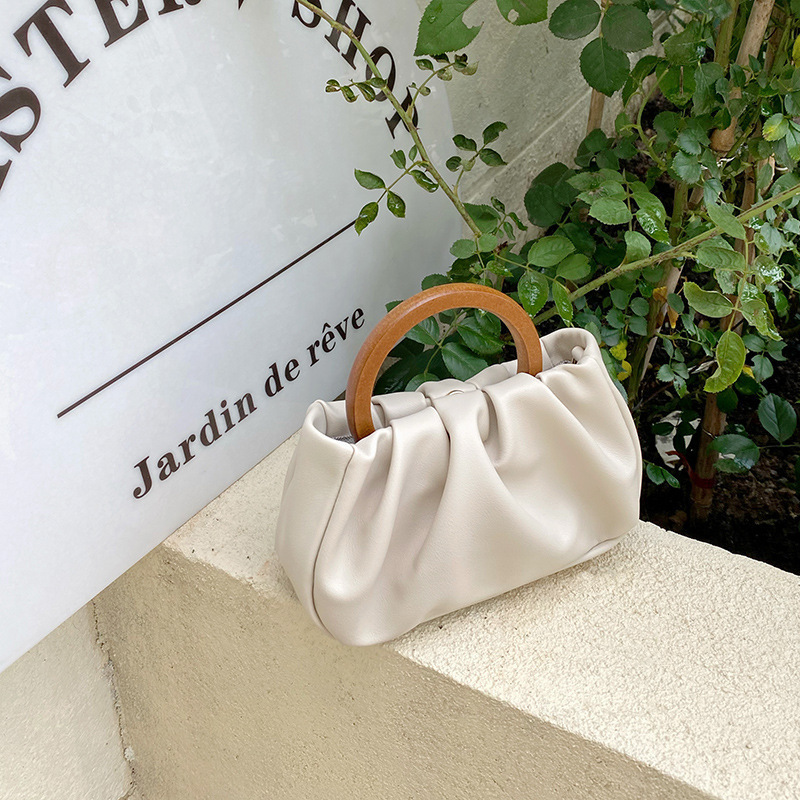 Foreign trade cross-border niche wooden handle pleated cloud handbag women's 2024 spring new crossbody mini bag trend