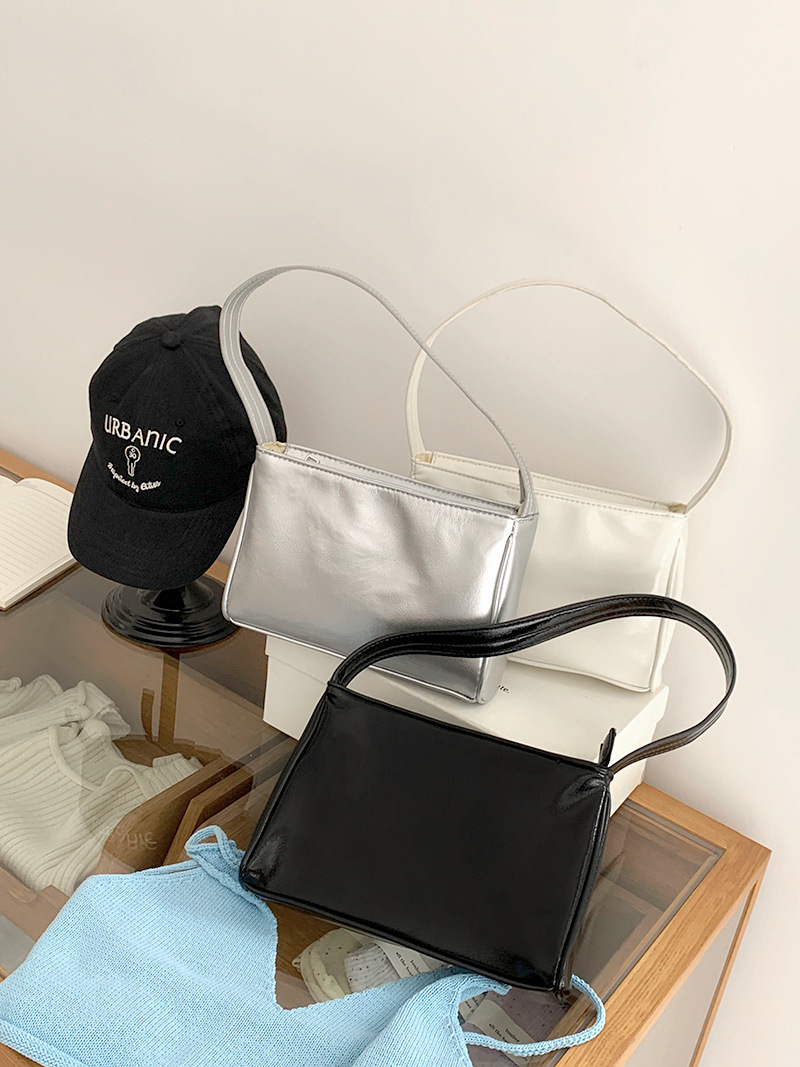 Korean new niche design silver armpit bag ins fashion commuting versatile soft leather fashionable hand shoulder bag