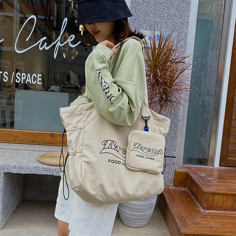 Korean version tote bag ins Harajuku shoulder large capacity nylon cloth bag female student portable shopping bag tote bag female