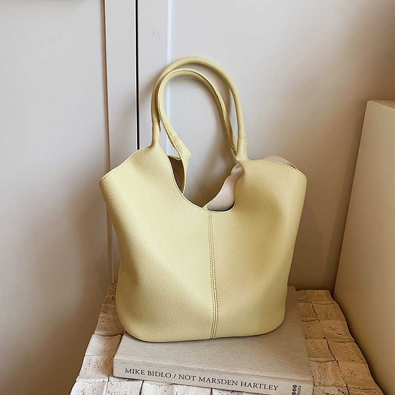 Portable simple niche design large capacity bucket bag women's 2024 summer new work commuter shoulder bag