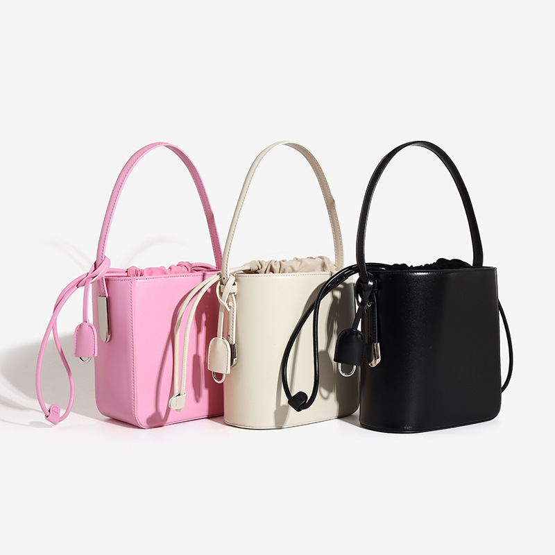 2024 new summer style niche high-end portable bucket bag for women with personality irregular one-shoulder cross-body drawstring bag