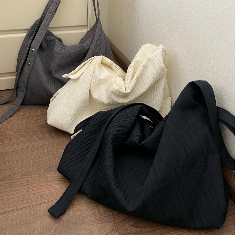 Korean niche texture striped backpack women's large-capacity commuting loose wandering bag student single shoulder crossbody bag