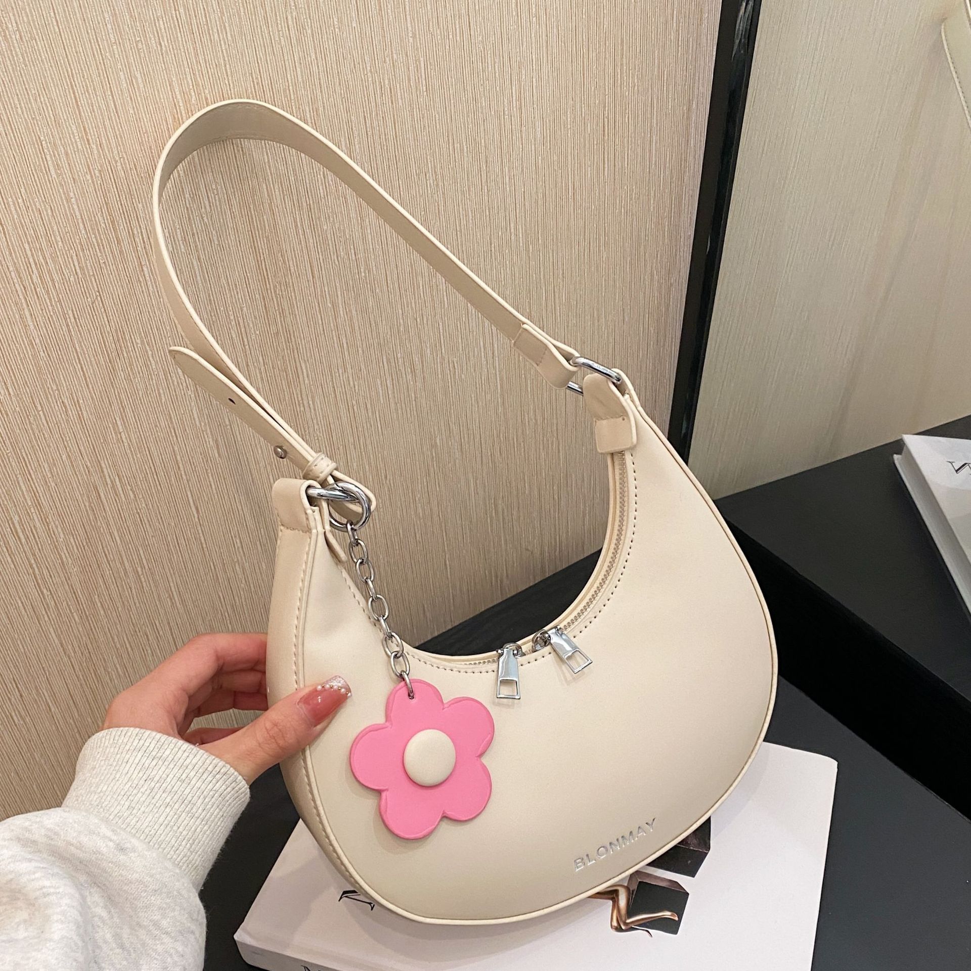 This year's popular textured small bags 2024 spring and summer new women's bags versatile single shoulder armpit bags niche half-moon bags