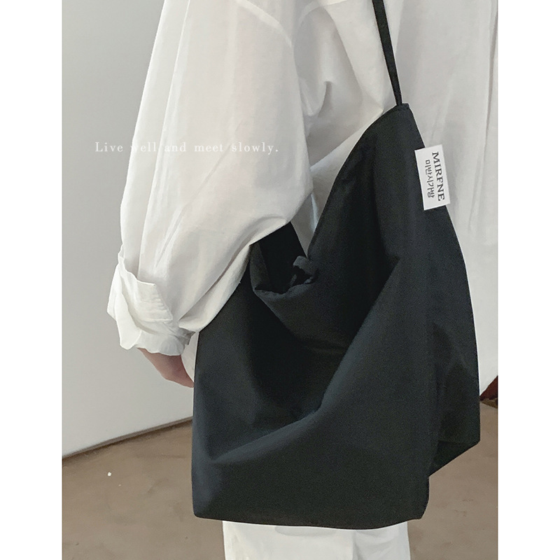 Casual large-capacity bag women's new simple canvas bag versatile shoulder armpit bag student class bag