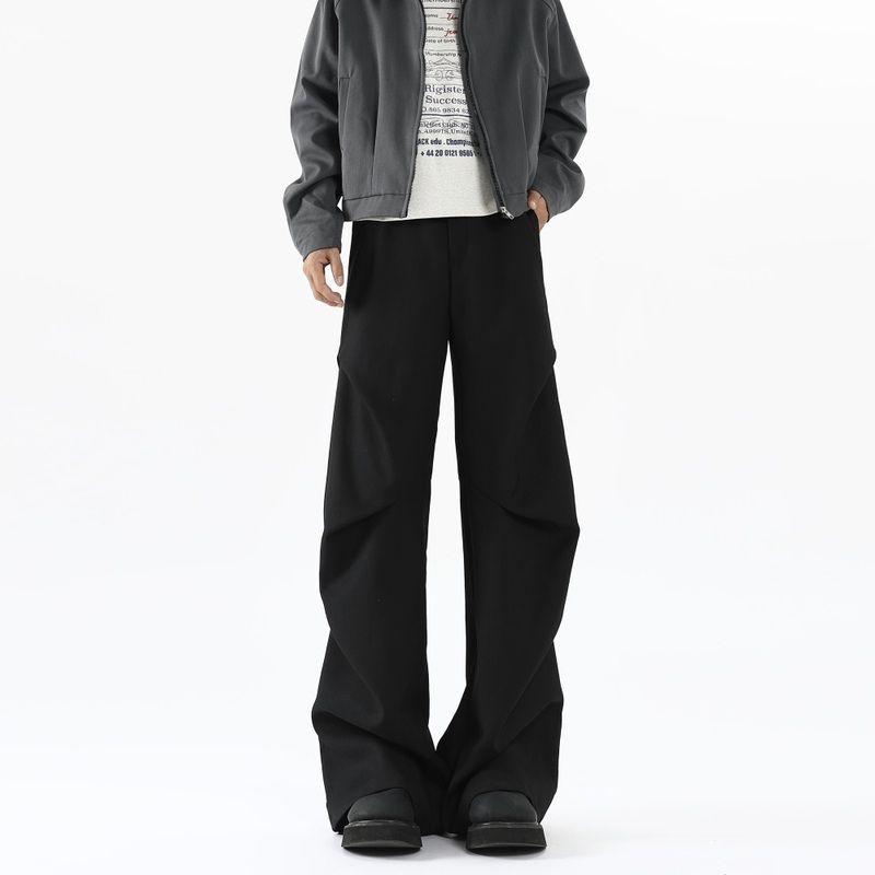 Trendy deconstructed pleated trousers and casual pants