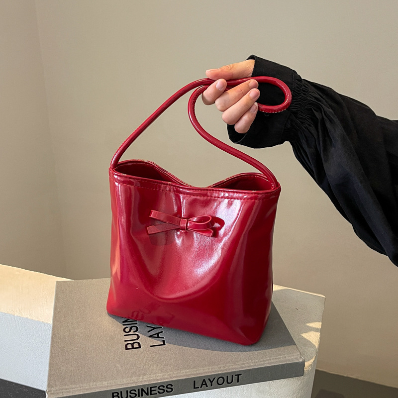 Korean style simple bow bucket bag for women 2024 summer new style high-end solid color portable shoulder underarm bag