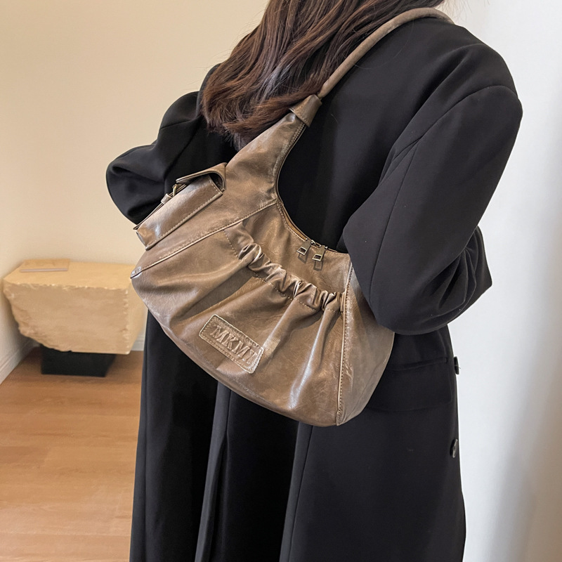 Niche high-end retro hottie armpit bag for women new Maillard style shoulder bag pleated dumpling bag