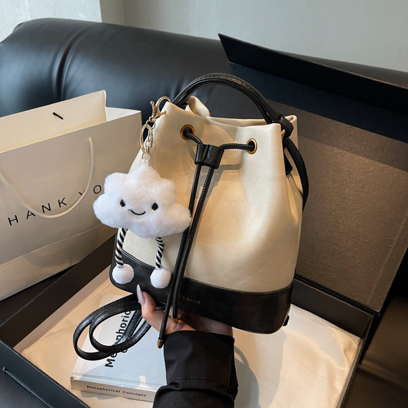 Textured bags 2024 new bright leather handbags for women, versatile bucket bags, high-end light luxury drawstring shoulder crossbody bags