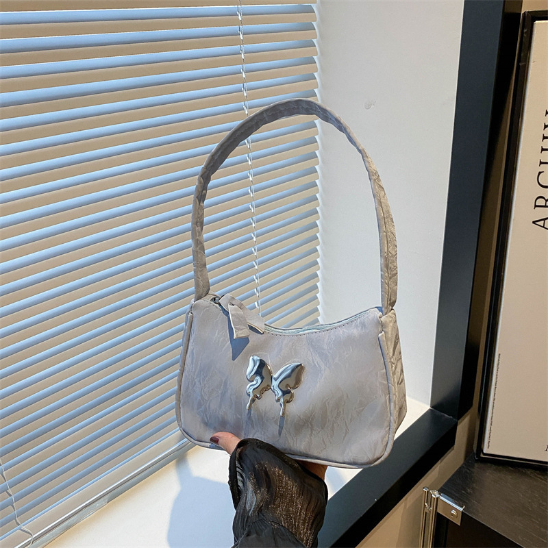 2024 summer new temperament fashion niche design one-shoulder cross-body foreign style solid color retro texture armpit bag