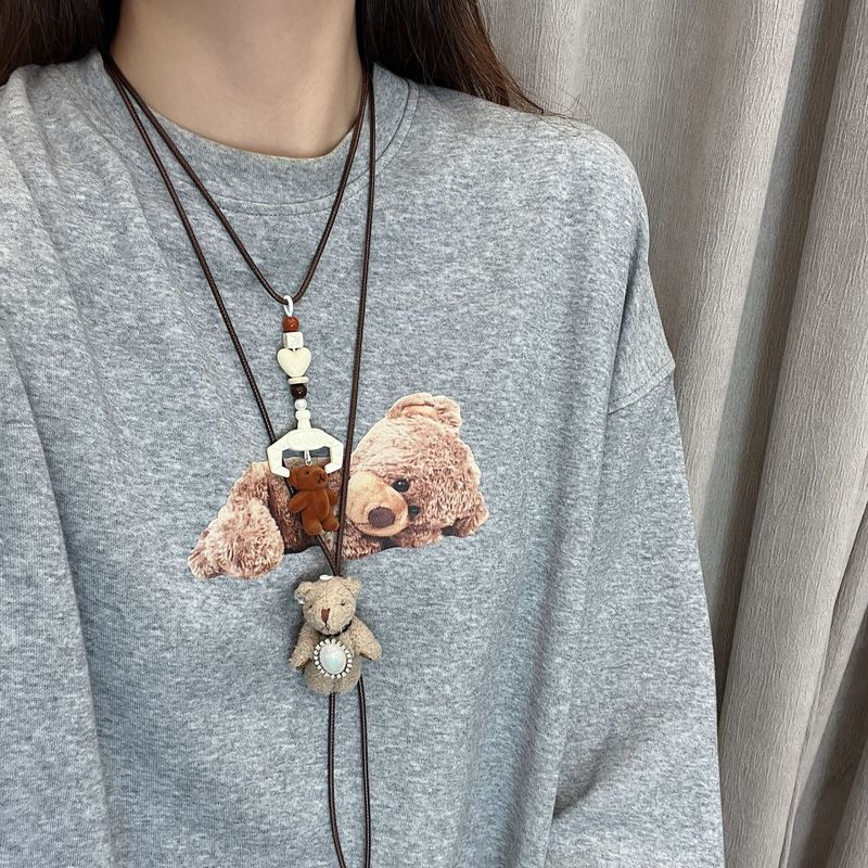 Korean childlike cute doll long pendant necklace women's autumn and winter plush halter neck accessories sweater chain sweatshirt chain
