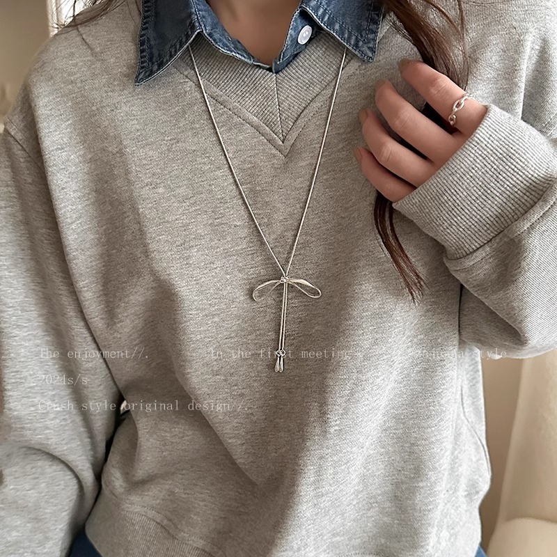 MIU bow metal necklace women's long temperament versatile sweater chain 2024 new light luxury high-end accessories