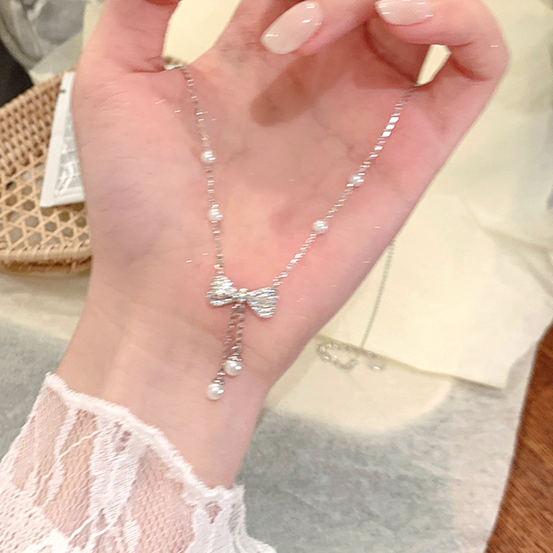 Pearl bow tassel pendant necklace for women, light luxury, high-end, simple, elegant, fashionable, versatile neck chain, clavicle chain