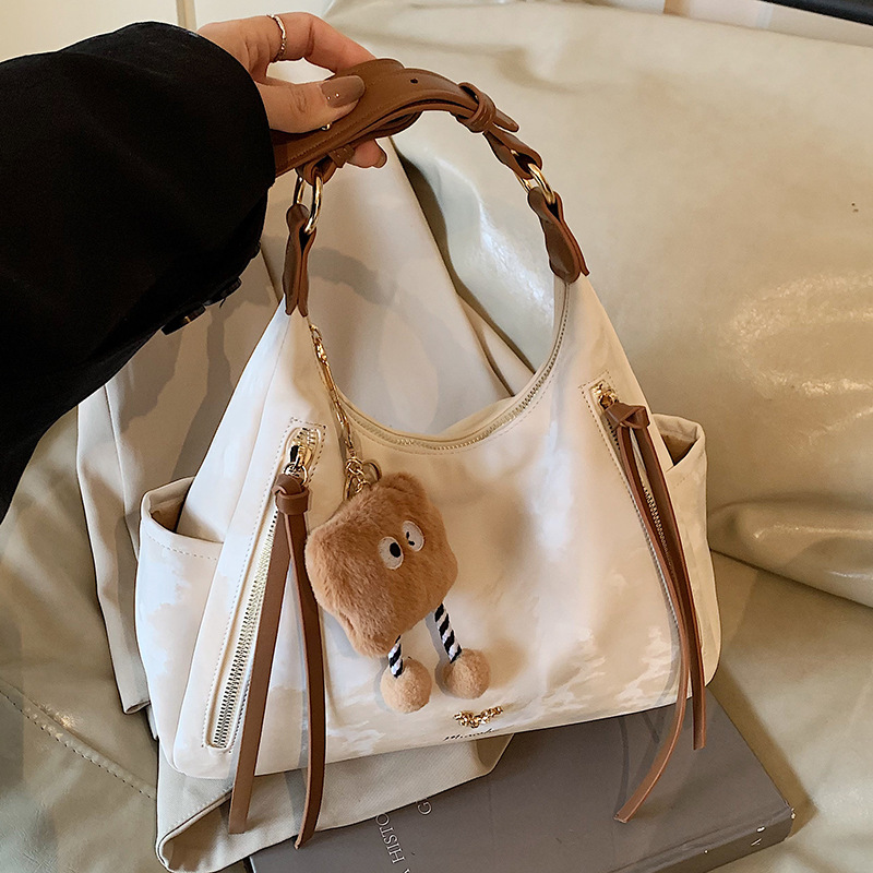This year's popular large-capacity tote bag 2024 new simple dumpling shoulder bag simple casual commuter bag crossbody