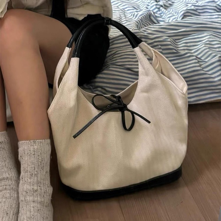 Niche retro one-shoulder canvas bag for women 2024 new Korean version simple small work bag armpit commuter bag