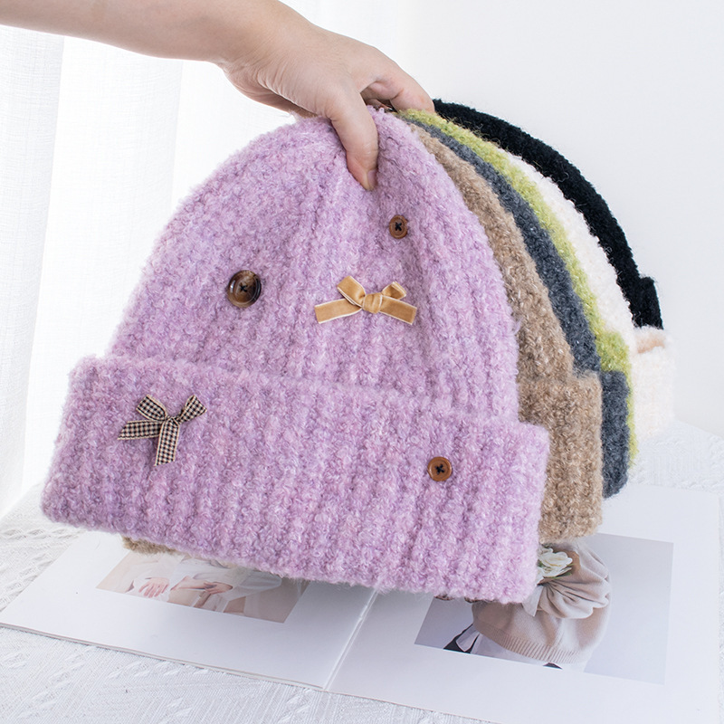 Korean style cute button bow knitted woolen hat for women in autumn and winter, warm and versatile, ear-protecting, large head circumference pullover hat
