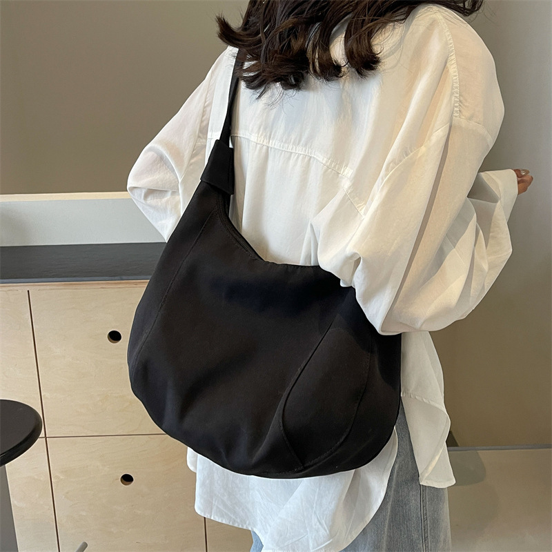 Canvas bag women's bag 2024 new solid color Ruiying fashion large capacity dumpling bag single shoulder crossbody commuter women's bag
