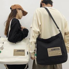 Men's crossbody bag, trendy brand, casual waterproof nylon canvas bag, large capacity shoulder bag, student couple backpack, women