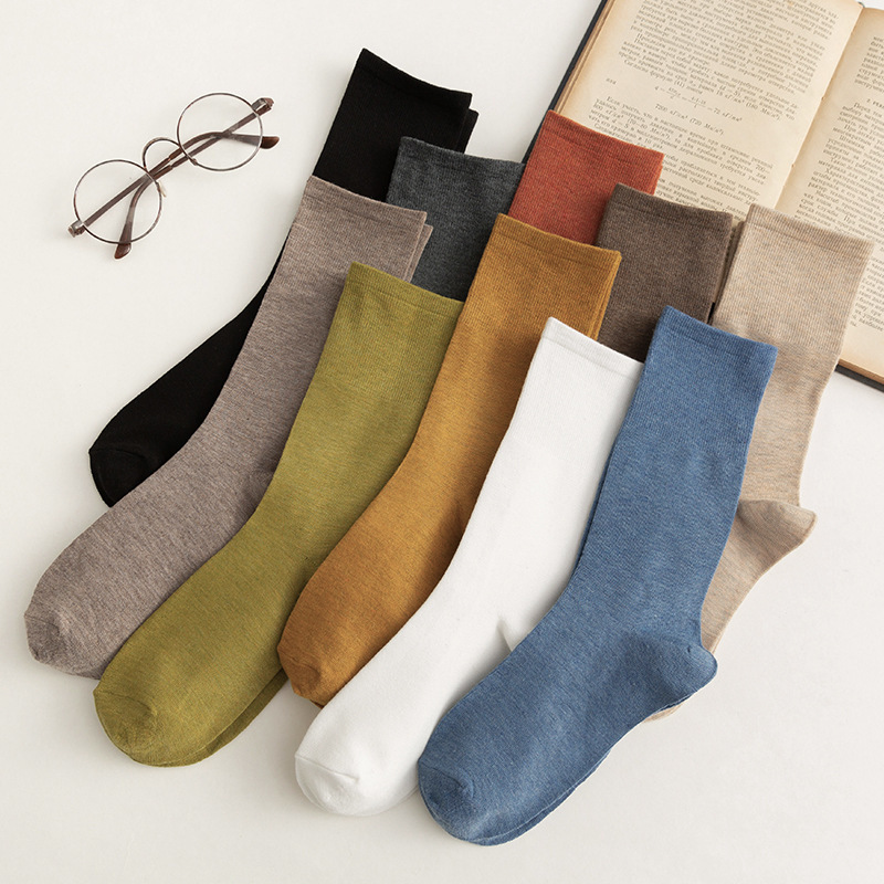 Women's mid-calf Korean style autumn and winter pile socks solid color Japanese retro ins style girls black stockings wholesale