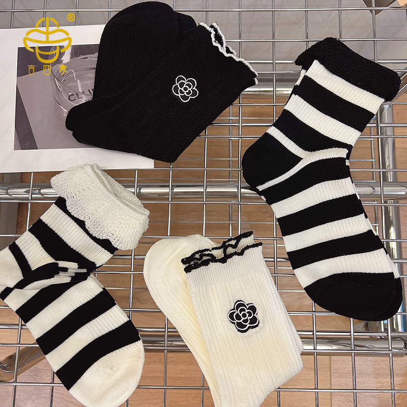 New Korean style black and white striped camellia mid-tube socks for women in autumn and winter